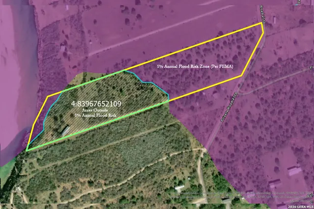 a view of a city with an aerial view of residential houses with outdoor space and trees