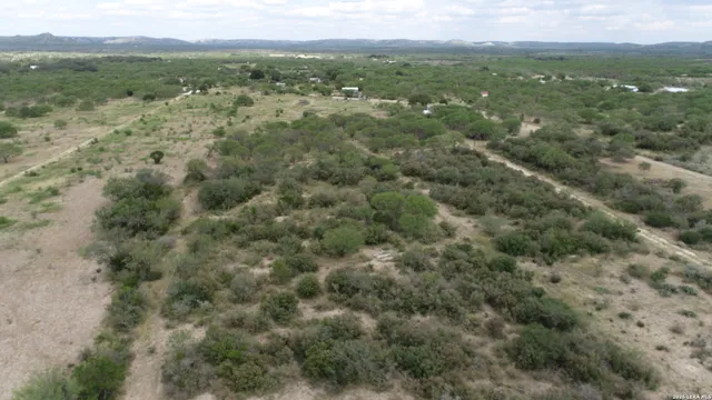 a view of a yard next to a yard