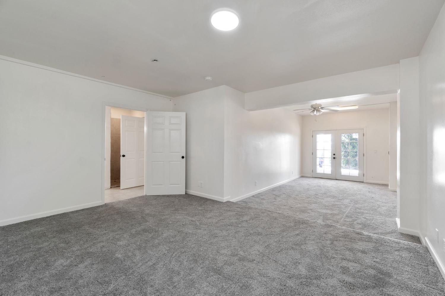 2832 East Westfall Road Mariposa, CA 95338 - Photo 30 of 38 a view of an empty room with window and wooden floor