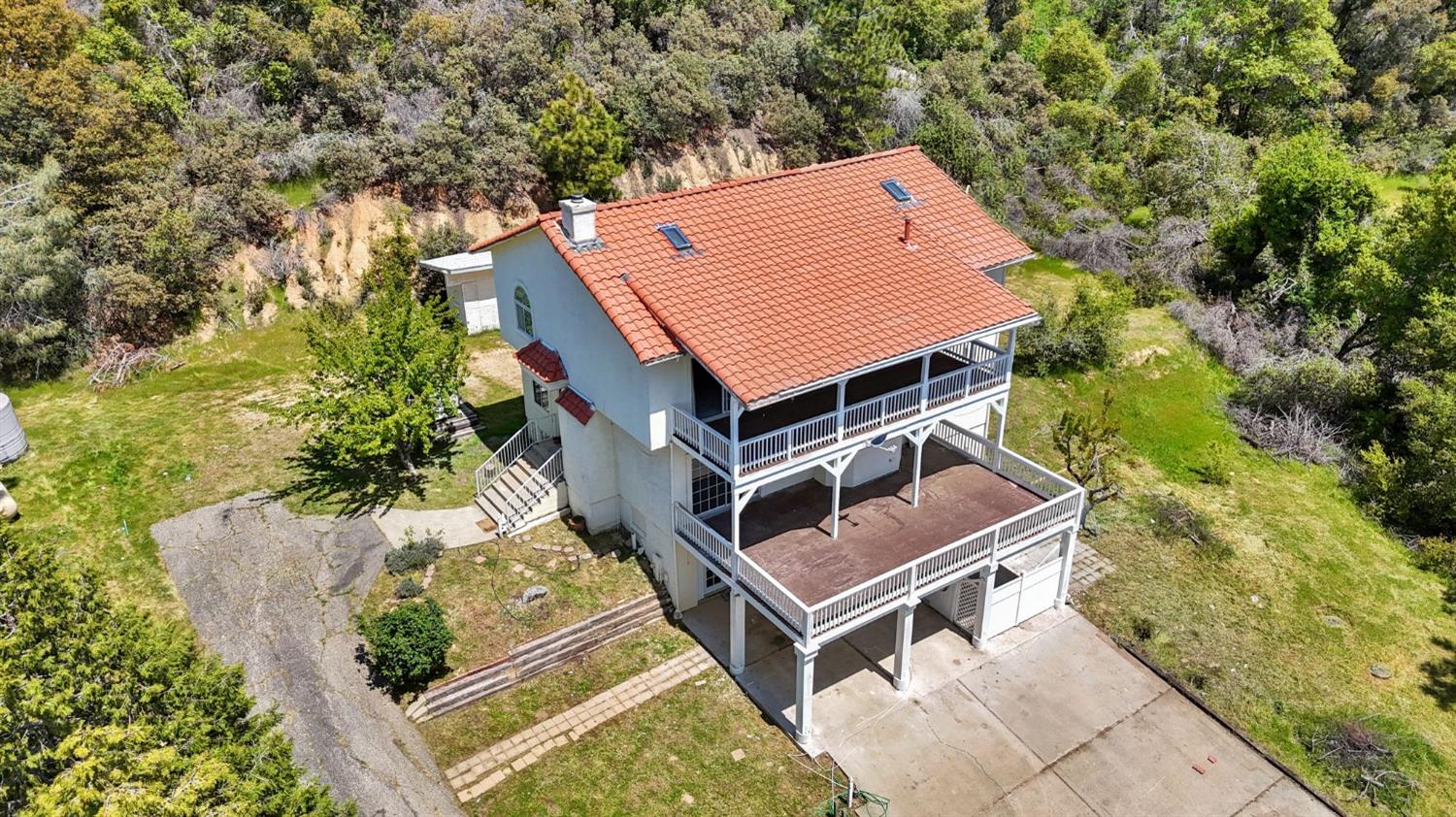 2832 East Westfall Road Mariposa, CA 95338 - Photo 37 of 38 an aerial view of a house with a yard and balcony