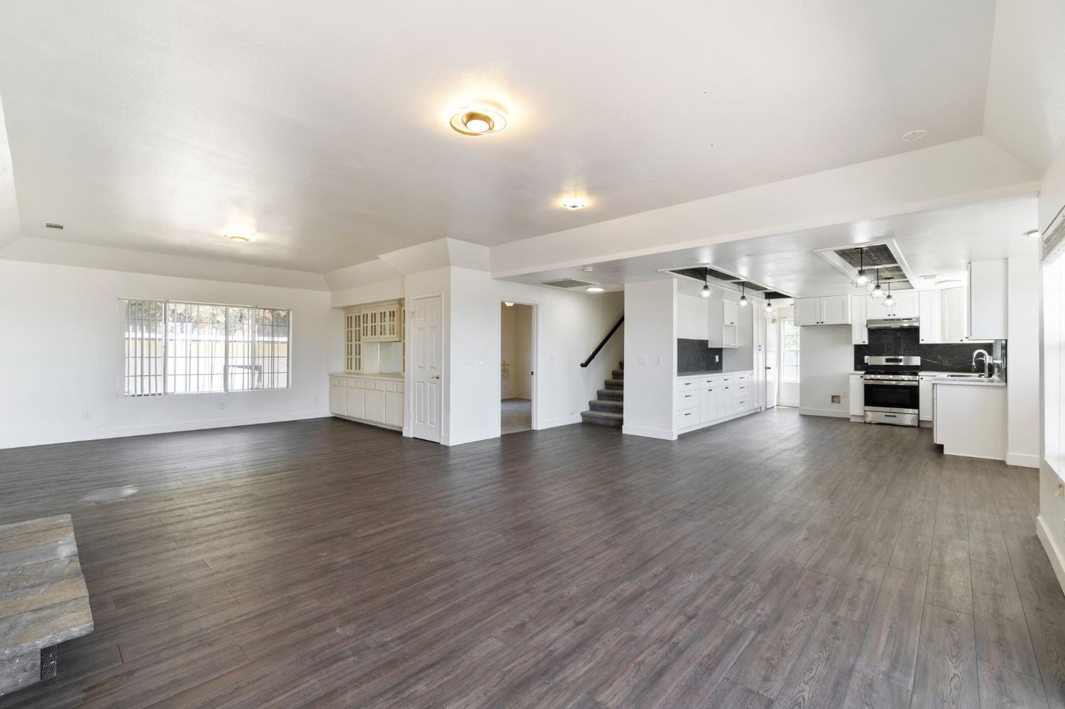 2832 East Westfall Road Mariposa, CA 95338 - Photo 4 of 38 an empty room with wooden floor and windows
