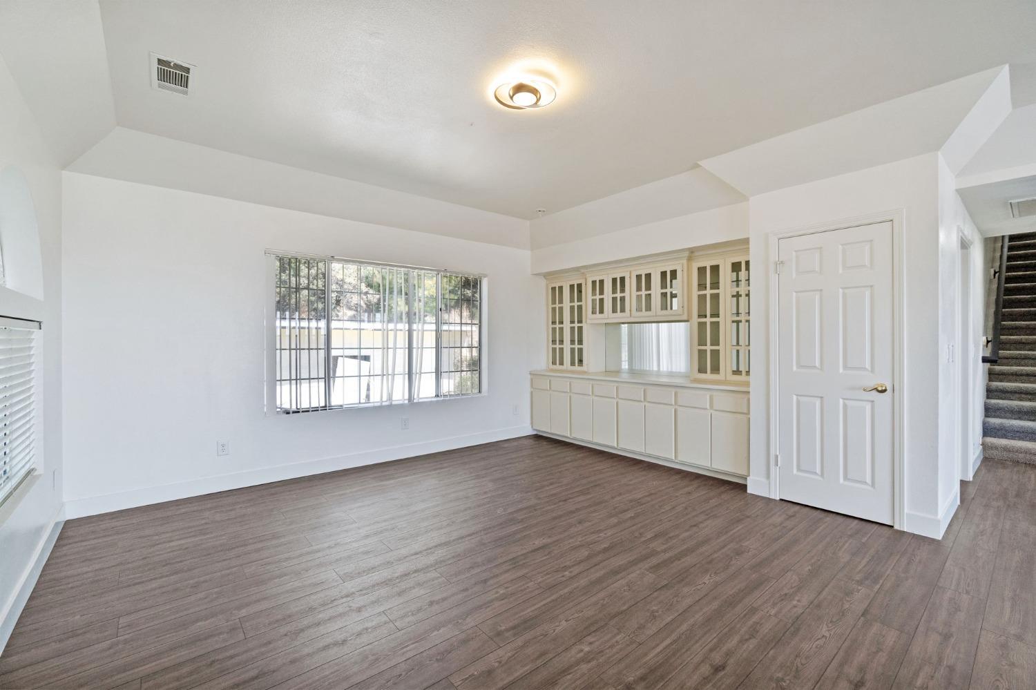 2832 East Westfall Road Mariposa, CA 95338 - Photo 5 of 38 an empty room with wooden floor and windows