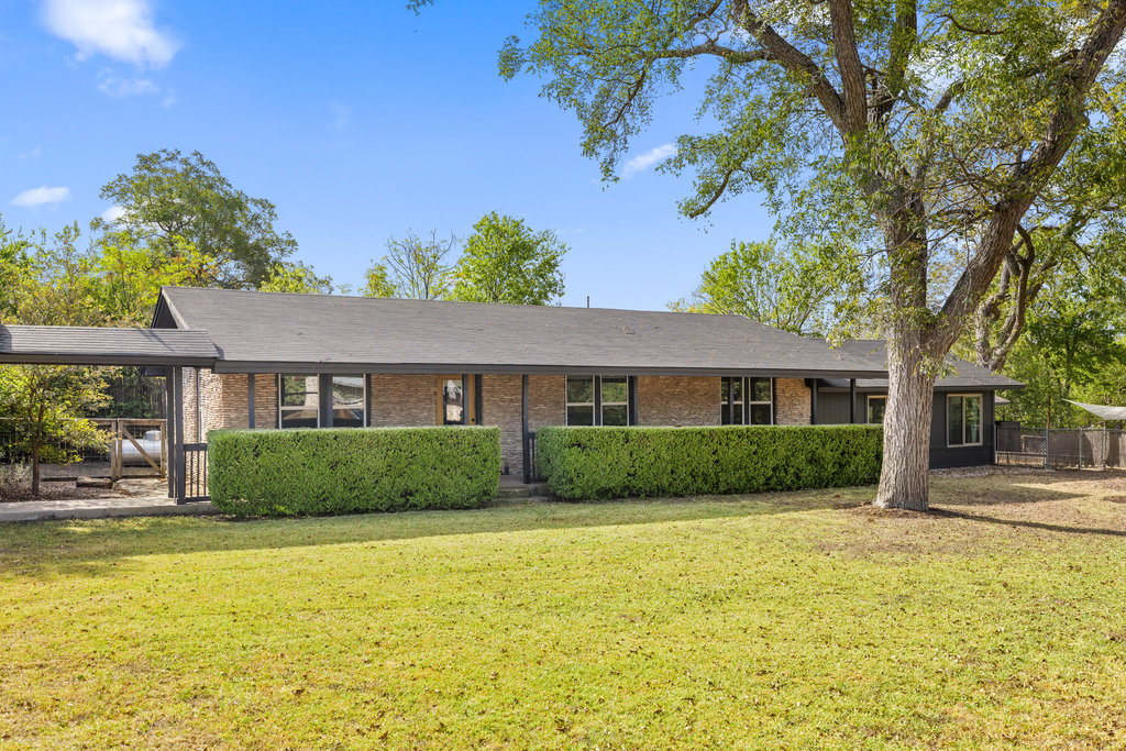7511 Old Bee Cave Road, Unit 2 Austin, TX 78735 - Photo 1 of 39 a front view of a house with a yard