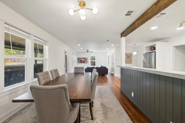a dining room with furniture and window