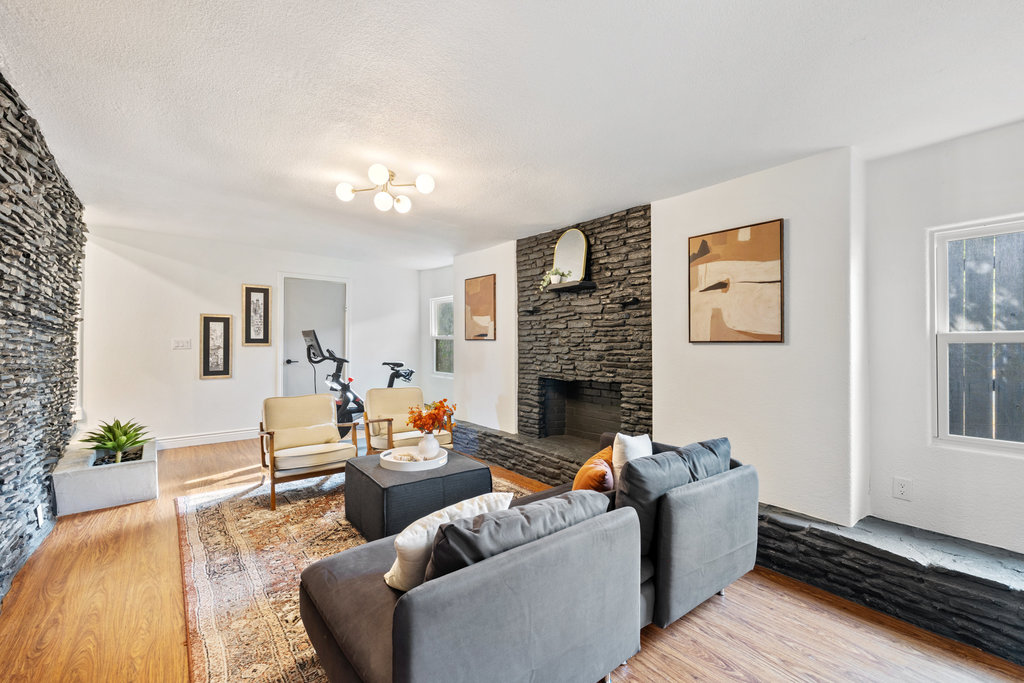 7511 Old Bee Cave Road, Unit 2 Austin, TX 78735 - Photo 2 of 39 a living room with furniture and a fireplace