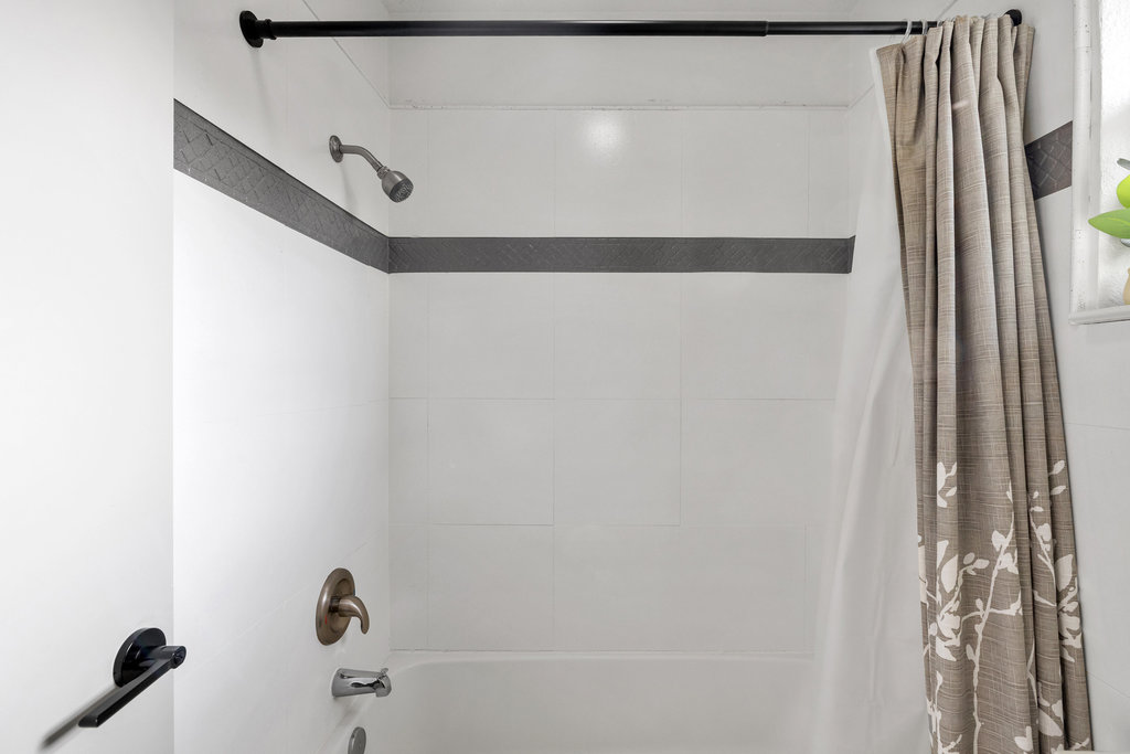 7511 Old Bee Cave Road, Unit 2 Austin, TX 78735 - Photo 22 of 39 a bathroom with a shower and a window