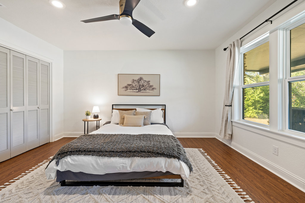 7511 Old Bee Cave Road, Unit 2 Austin, TX 78735 - Photo 23 of 39 a bedroom with a large bed and a window