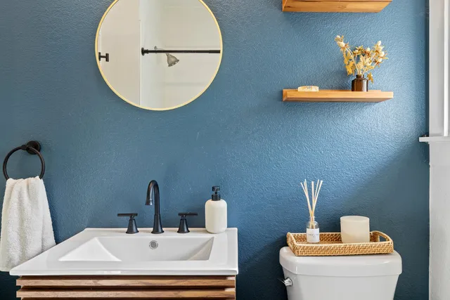 a bathroom with a sink and a mirror