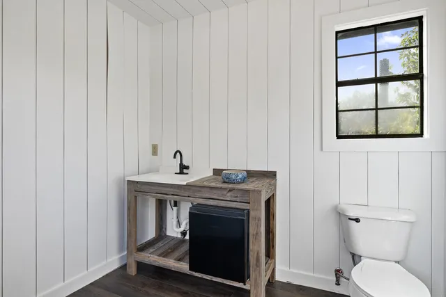 a view of washer and dryer with wooden floor