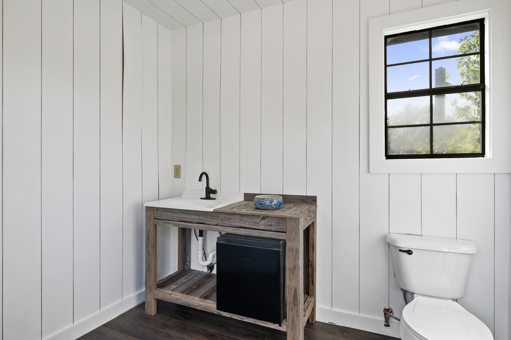 7511 Old Bee Cave Road, Unit 2 Austin, TX 78735 - Photo 26 of 39 a view of washer and dryer with wooden floor