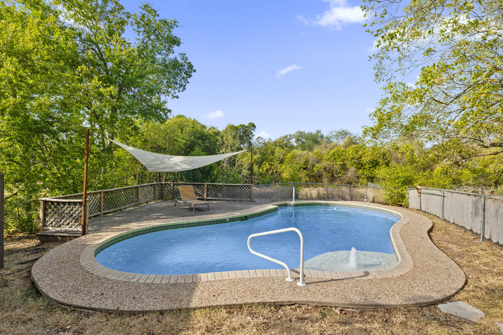 7511 Old Bee Cave Road, Unit 2 Austin, TX 78735 - Photo 30 of 39 a view of a swimming pool with a yard