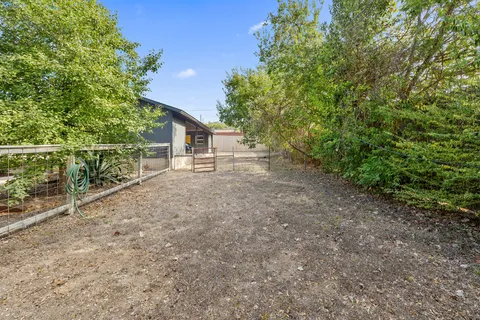 a view of a house with a backyard