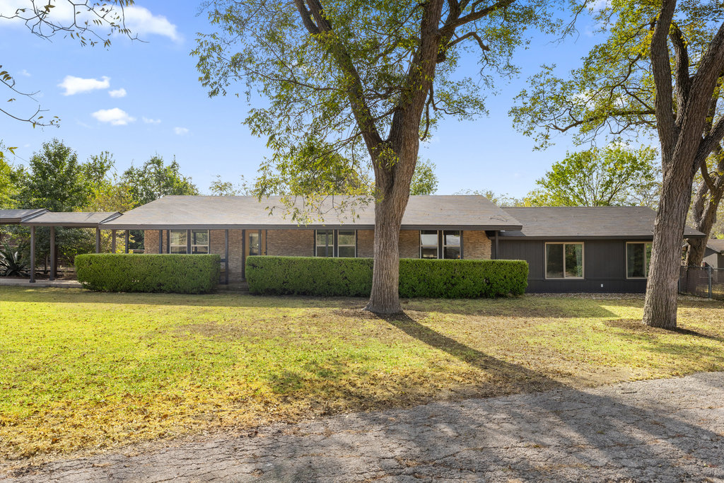 7511 Old Bee Cave Road, Unit 2 Austin, TX 78735 - Photo 36 of 39 a front view of a house with a garden