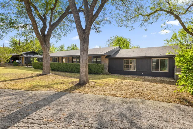 a house with trees in front of it