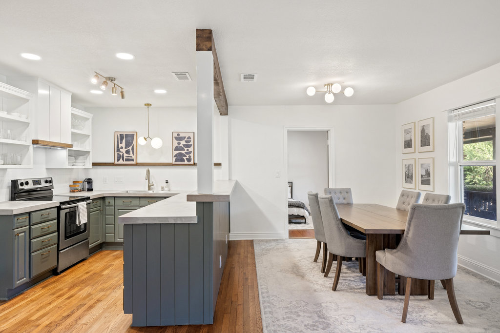 7511 Old Bee Cave Road, Unit 2 Austin, TX 78735 - Photo 10 of 39 a large kitchen with a table and chairs in it