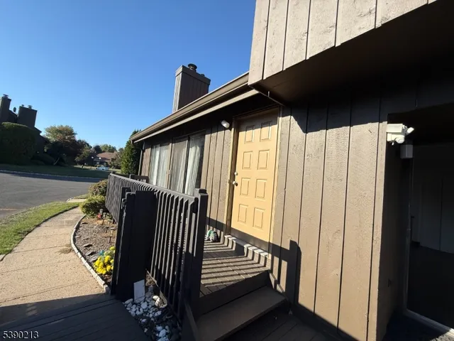 a view of a porch with wooden floor and stairs