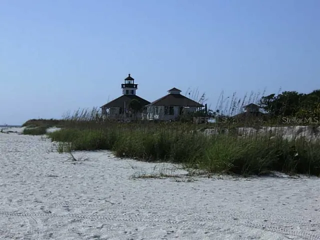 a view of a swimming pool with a yard