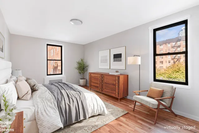 a kitchen with a refrigerator a sink and dishwasher with wooden floor