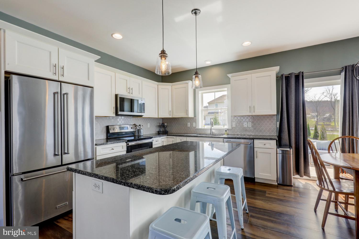 73 Summers Drive Stevens, PA 17578 - Photo 19 of 42 a kitchen with a sink stainless steel appliances a refrigerator and a window