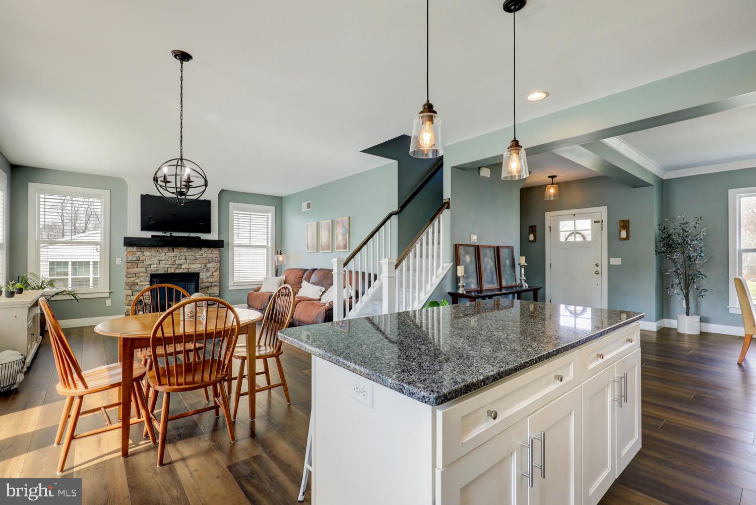 73 Summers Drive Stevens, PA 17578 - Photo 22 of 42 a view of dining room and livingroom with furniture wooden floor a chandelier