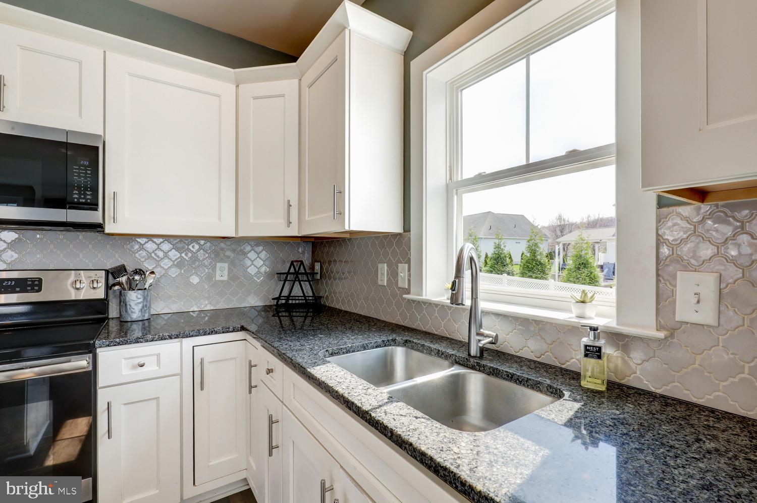 73 Summers Drive Stevens, PA 17578 - Photo 24 of 42 a kitchen with granite countertop a sink a counter top space and cabinets