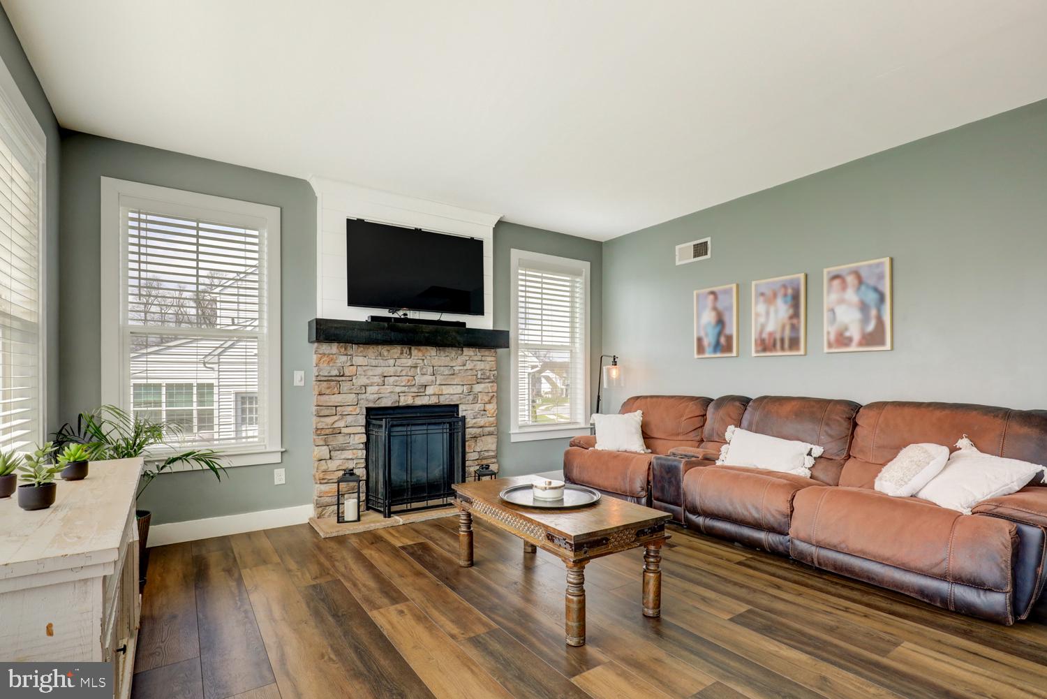73 Summers Drive Stevens, PA 17578 - Photo 26 of 42 a living room with furniture a flat screen tv and a fireplace