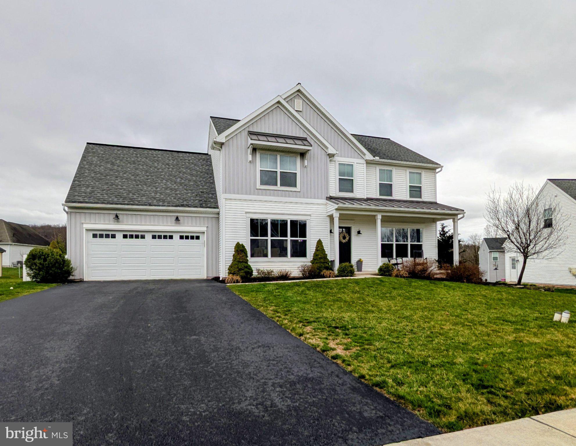 73 Summers Drive Stevens, PA 17578 - Photo 4 of 42 a front view of a house with a garden