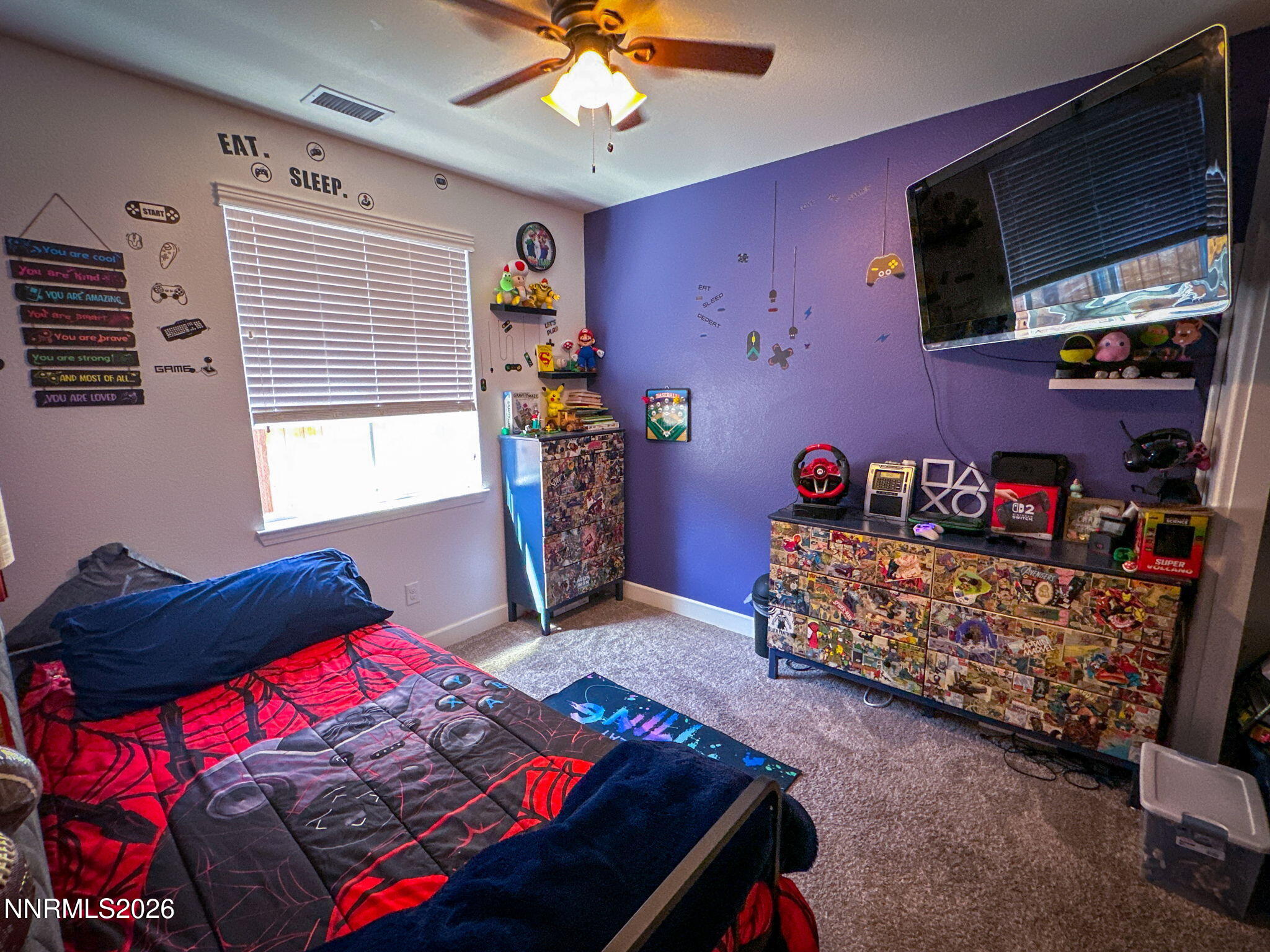 7330 Overture Drive Reno, NV 89506 - Photo 11 of 17 a bedroom with a bed and a flat tv screen on dresser