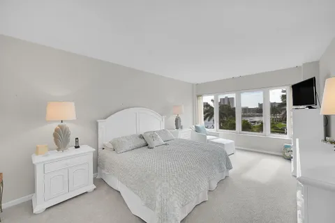 a large white bed in a white room