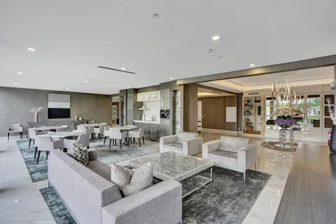 a living room with lots of furniture and a flat screen tv