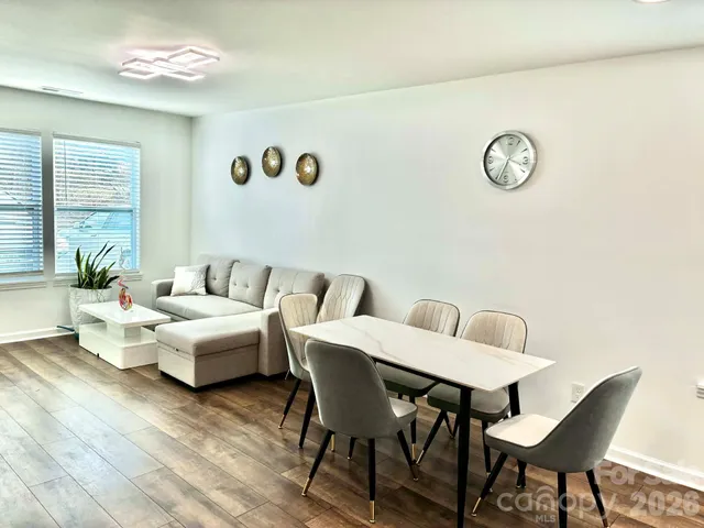 a view of a livingroom with furniture and a table