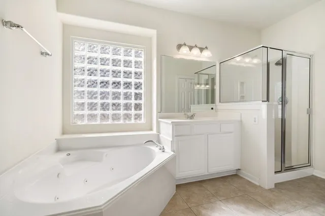 a bathroom with a bathtub and a sink