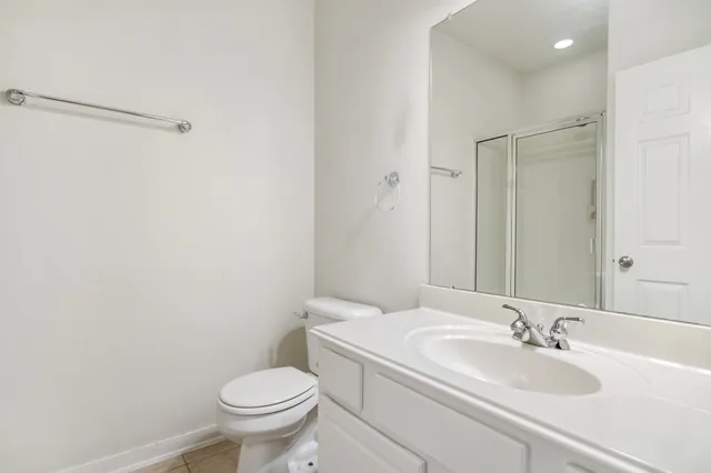 a bathroom with a sink toilet and a mirror