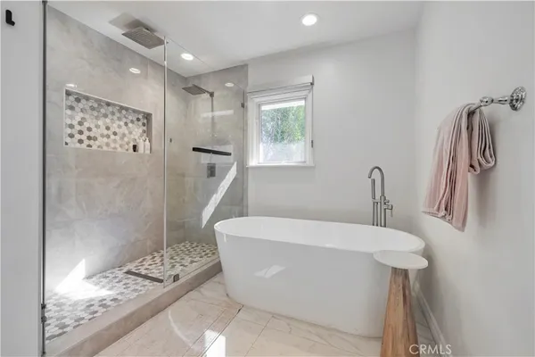 a spacious bathroom with double sink and a mirror