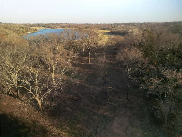 a view of a lake with a yard