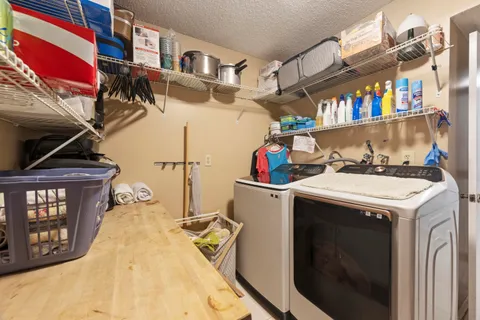a utility room with washer and dryer