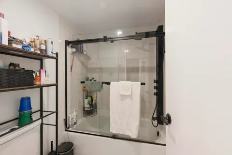 a en suite bathroom with a sink and mirror