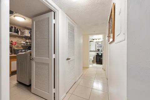 a bedroom with a bed and a tv