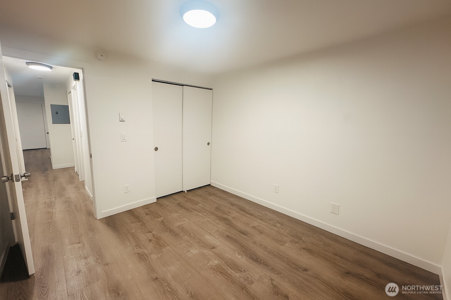 11211 Northeast 68th Street, Unit 3 Kirkland, WA 98033 - Photo 18 of 21 wooden floor in an empty room