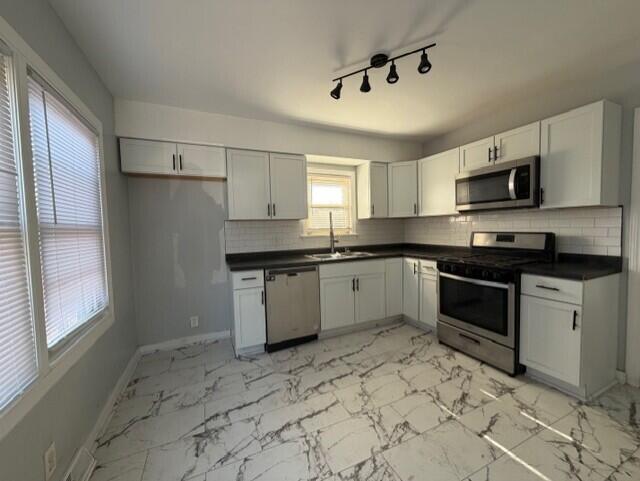 3134 Cleveland Street Hammond, IN 46323 - Photo 2 of 15 a kitchen with a stove sink and microwave