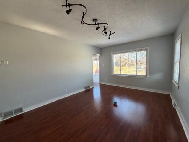 3134 Cleveland Street Hammond, IN 46323 - Photo 4 of 15 a view of an empty room with wooden floor and a window