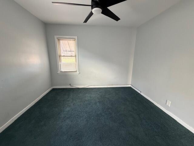 3134 Cleveland Street Hammond, IN 46323 - Photo 8 of 15 an empty room with a window and a ceiling fan