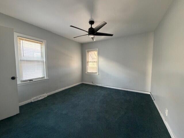 3134 Cleveland Street Hammond, IN 46323 - Photo 9 of 15 an empty room with a window and a fan