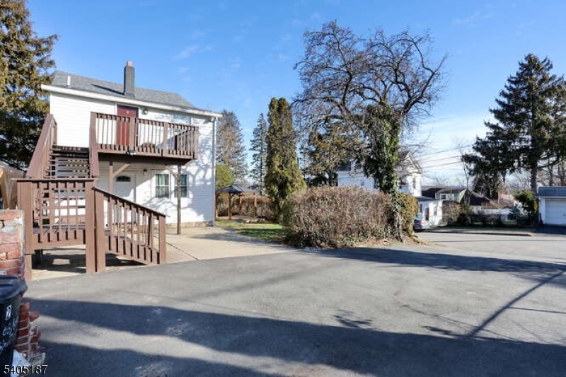 68 Mohawk Avenue Hawthorne, NJ 07506 - Photo 19 of 24 a front view of a house with a garden