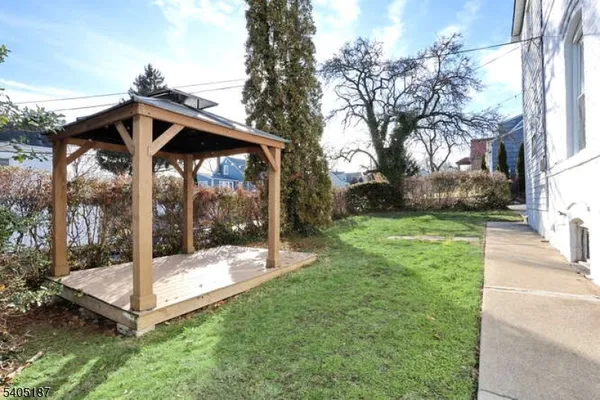 a view of a wooden deck with a backyard