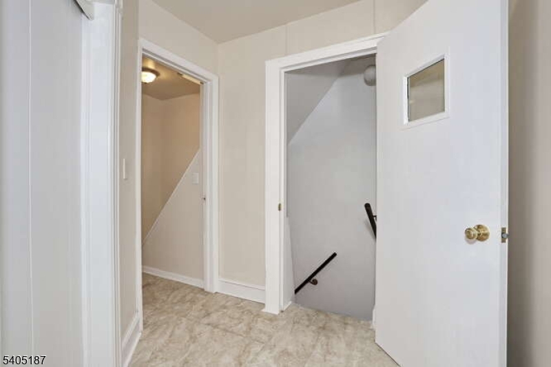 68 Mohawk Avenue Hawthorne, NJ 07506 - Photo 4 of 24 a view of a hallway with closet and a door