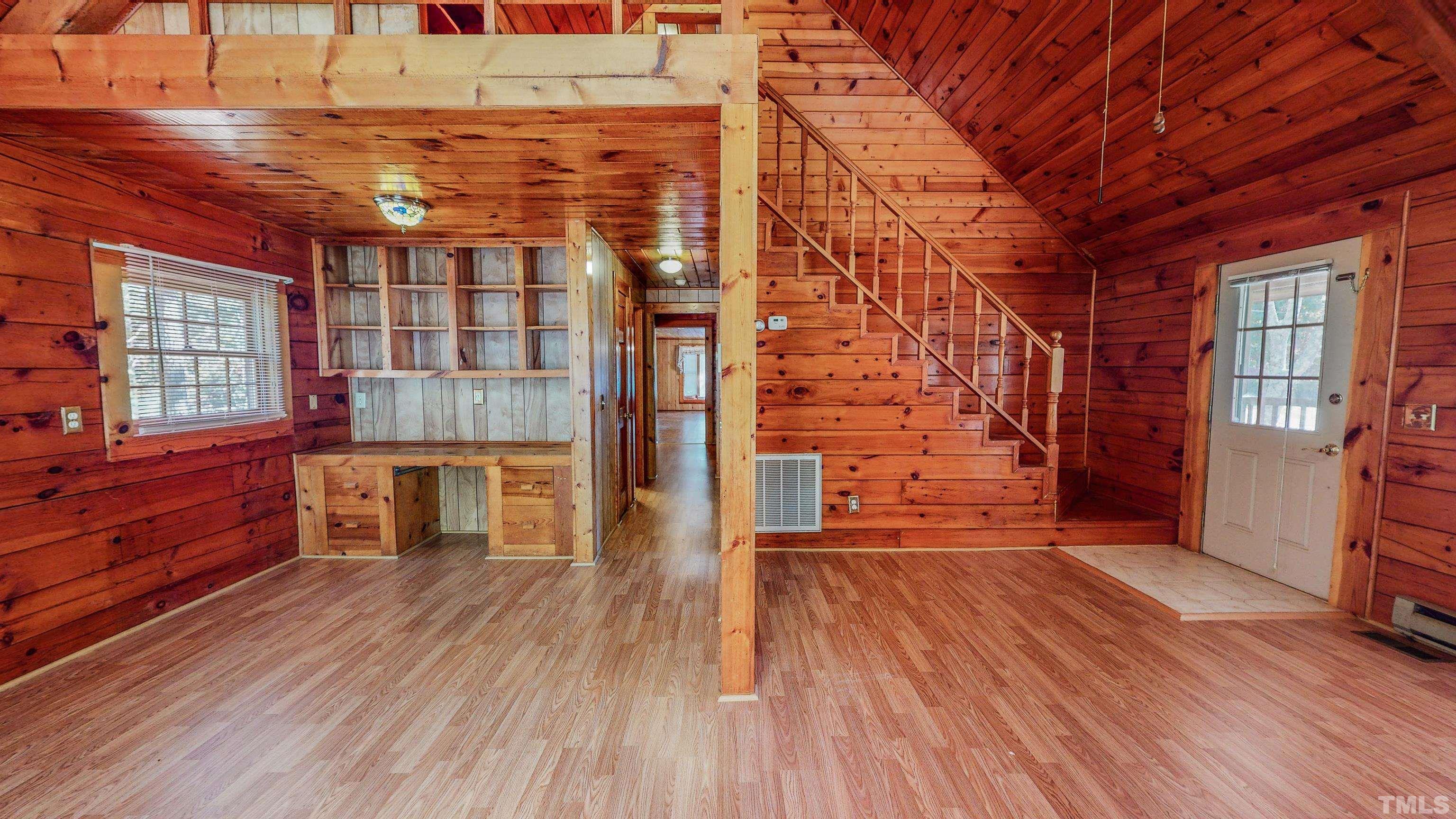 412 Shiloh Church Road Roxboro, NC 27574 - Photo 11 of 30 an empty room with wooden floor and windows