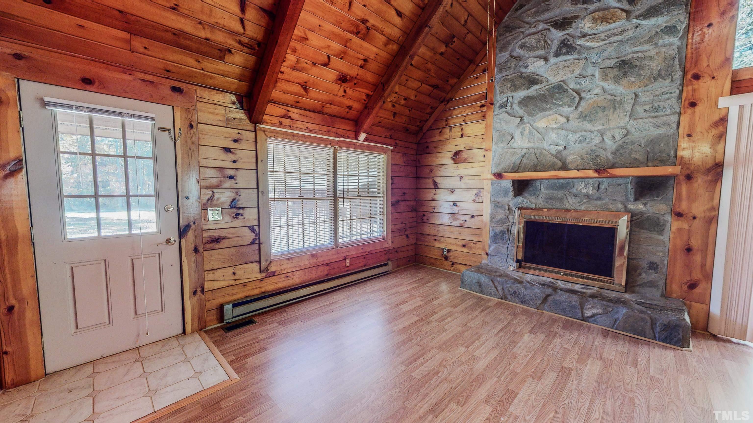 412 Shiloh Church Road Roxboro, NC 27574 - Photo 12 of 30 a view of a livingroom with a fireplace and window