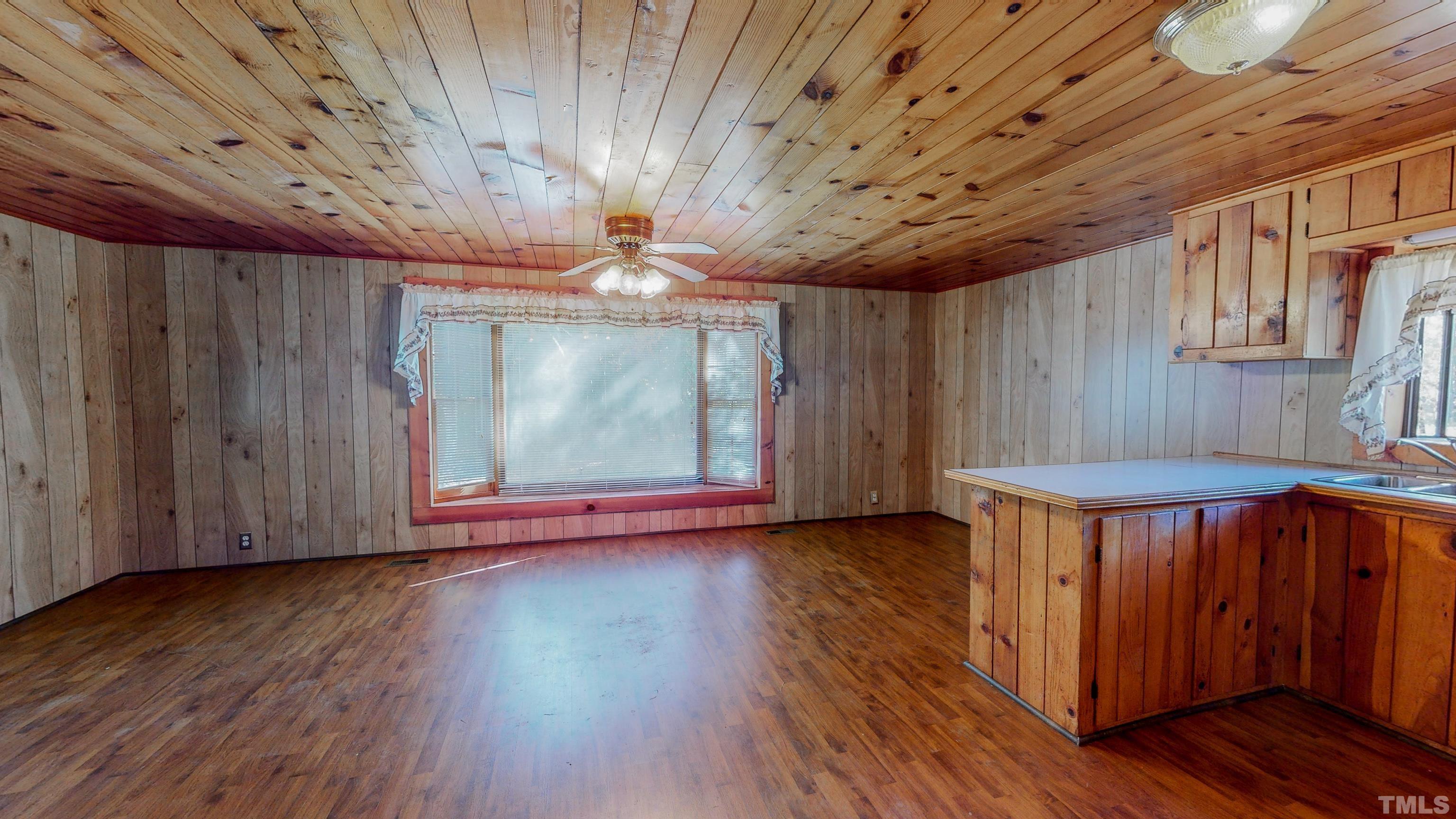 412 Shiloh Church Road Roxboro, NC 27574 - Photo 13 of 30 a view of a room with wooden floors and natural light