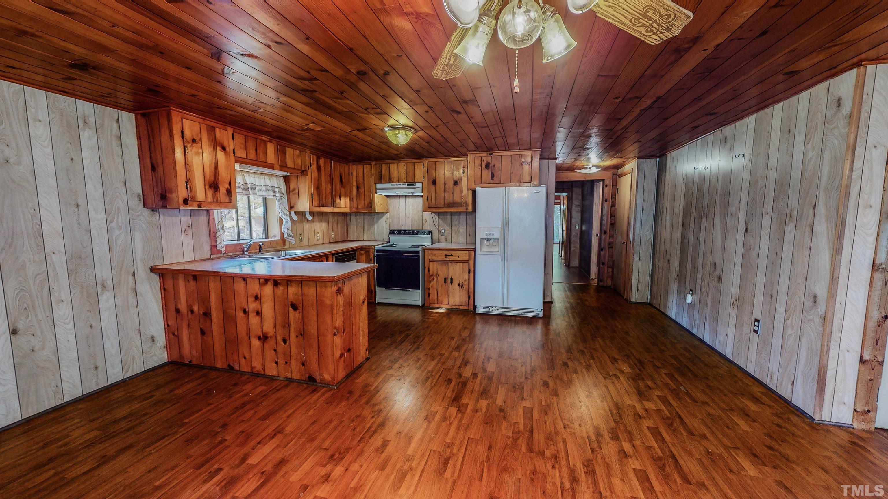 412 Shiloh Church Road Roxboro, NC 27574 - Photo 16 of 30 a view of kitchen with furniture and wooden floor